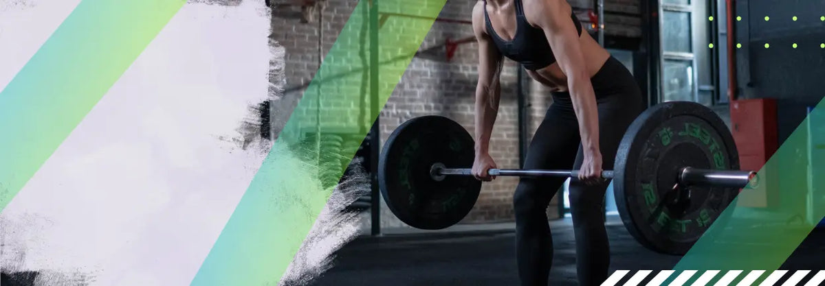 Athlete lifting a barbell from the floor in a gym