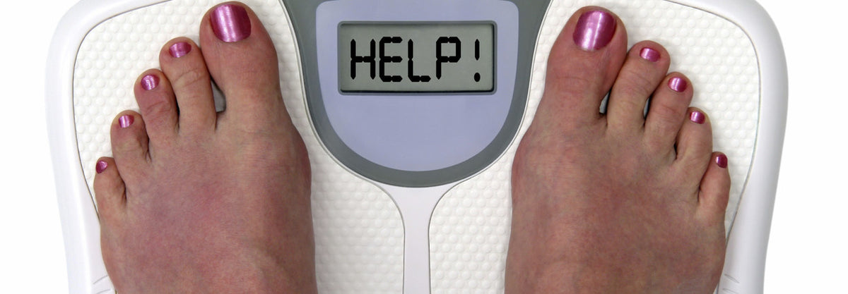 Feet on a weighing scale displaying HELP