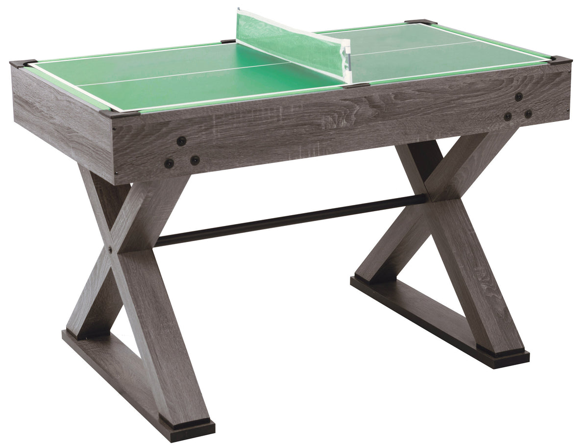 Grijze voetbaltafel met groen tafeltennisblad en net.