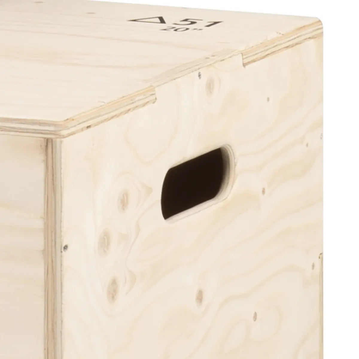 Close-up of an oval handhold in the side of a wooden plyo box.